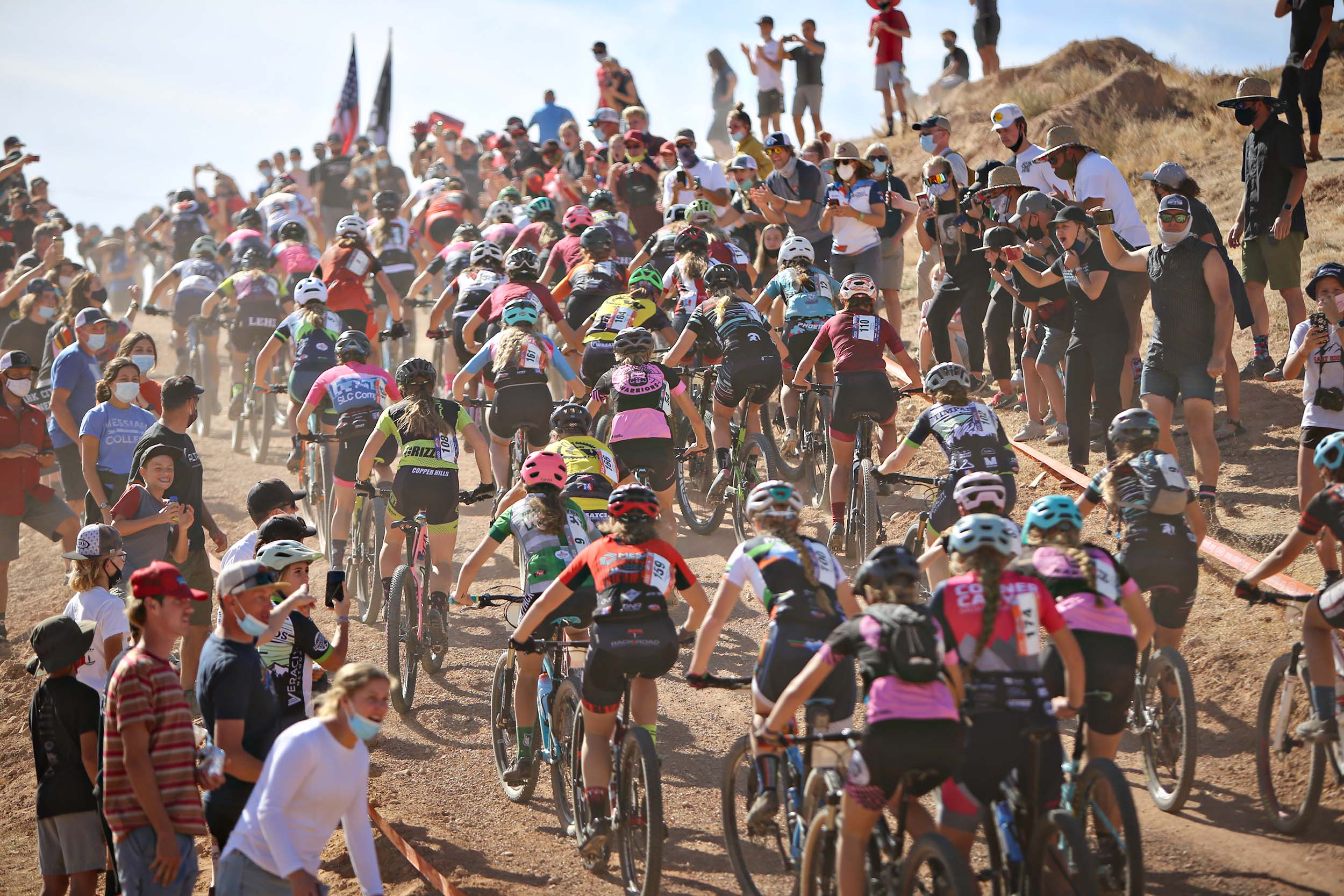 group of nica racers pedaling up climb