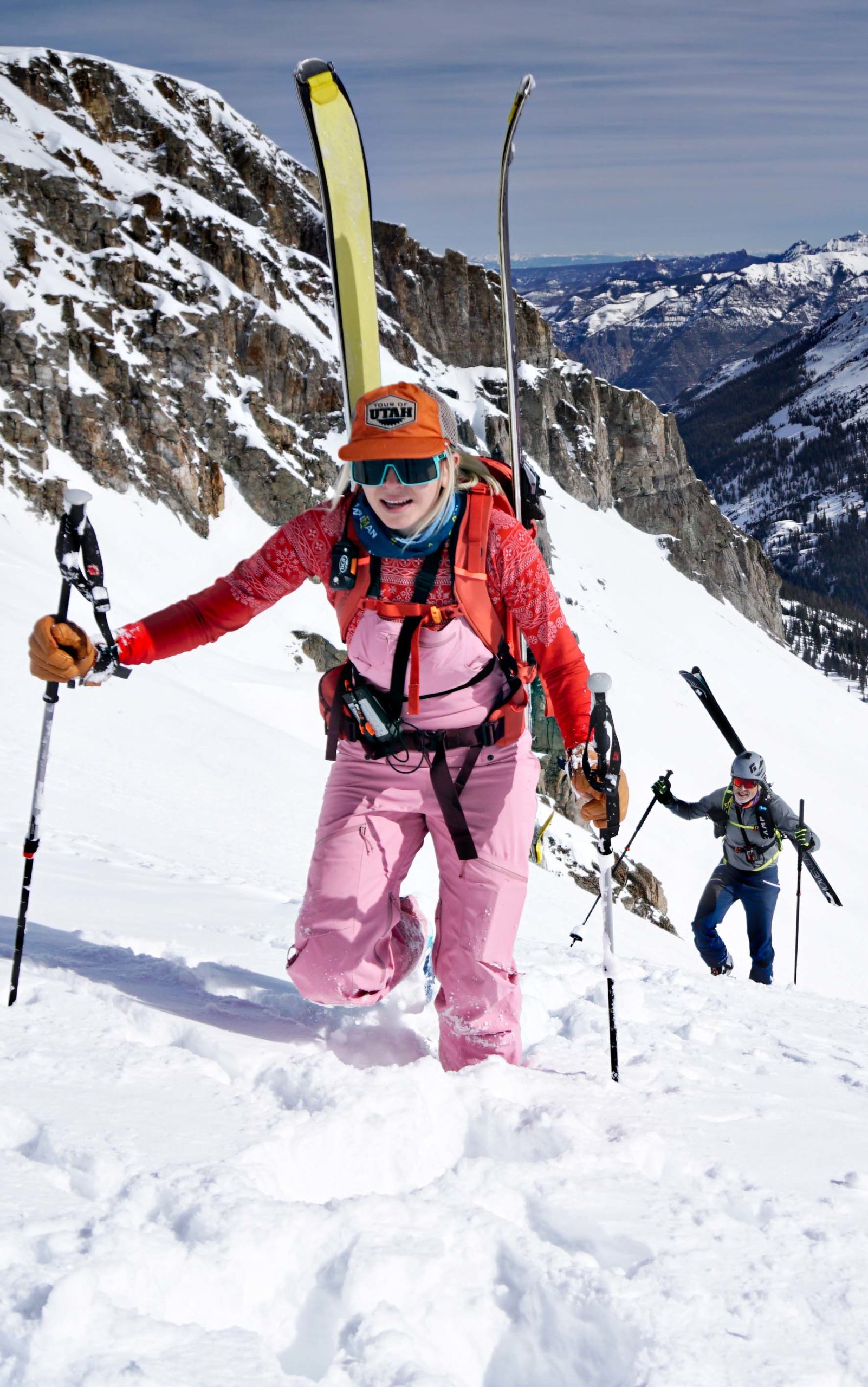 female skier walking up mountain