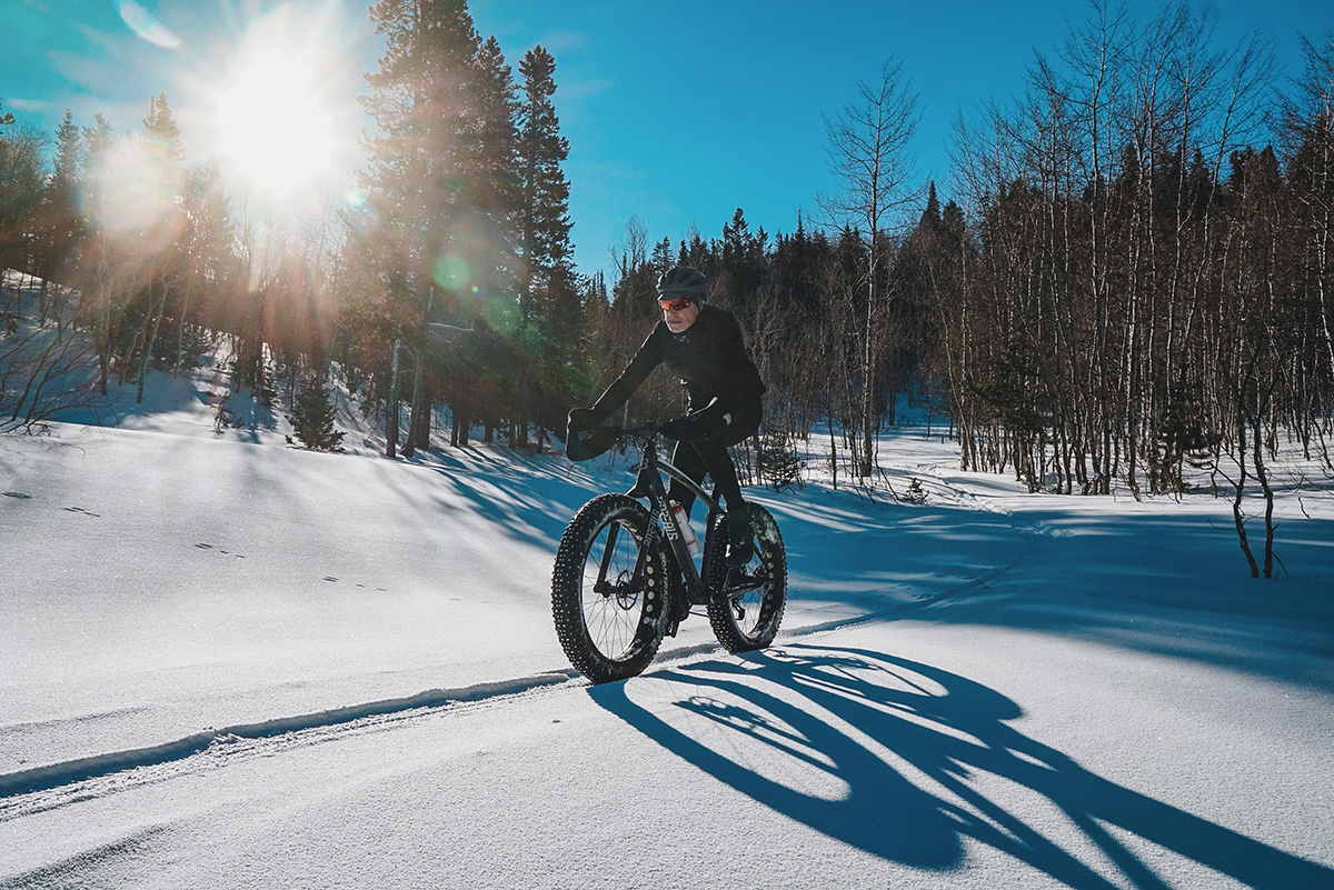 fat biker riding in snow wearing dna cycling kit