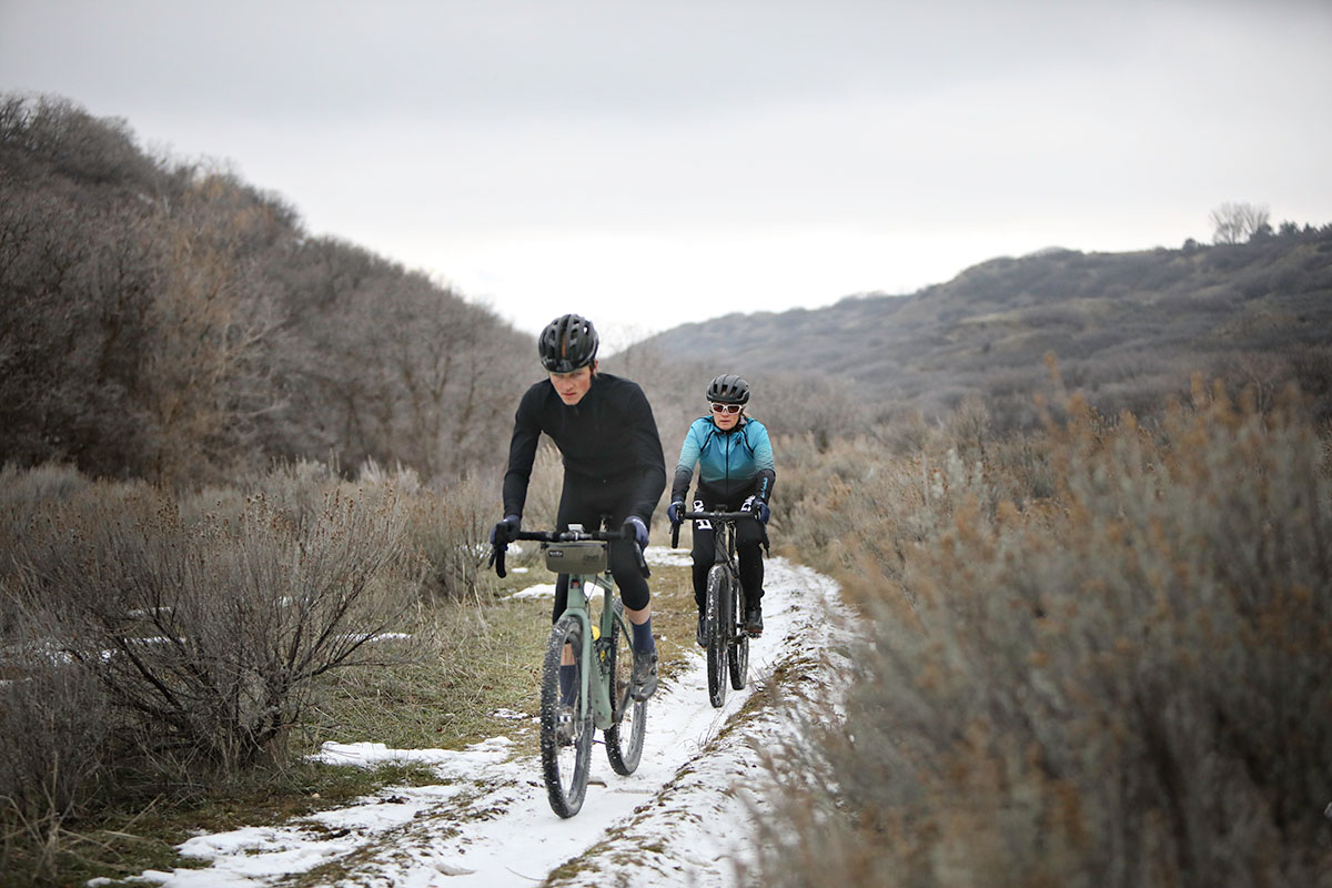 two bikers riding on snow in dna cycling clothing