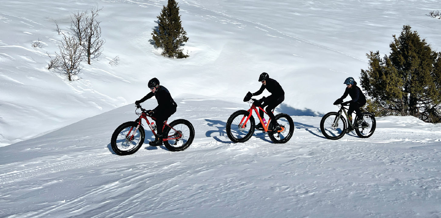 three people biking