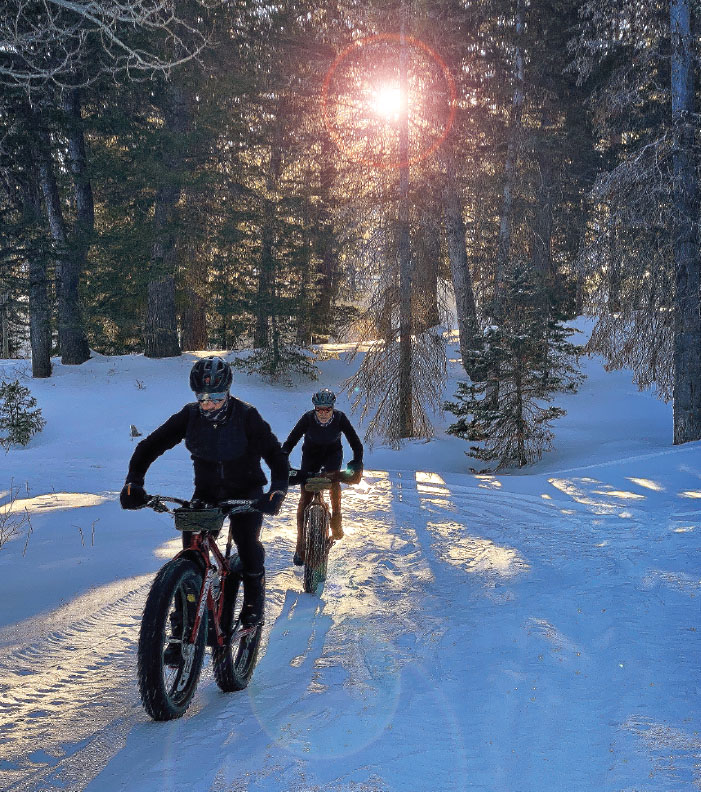 two people fat biking in dna cycling gear